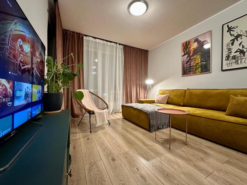 Televízia a/alebo spoločenská miestnosť v ubytovaní MOMOApart - Downtown Tram Depot