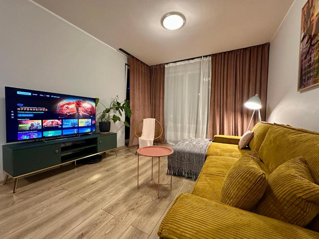 Televízia a/alebo spoločenská miestnosť v ubytovaní MOMOApart - Downtown Tram Depot