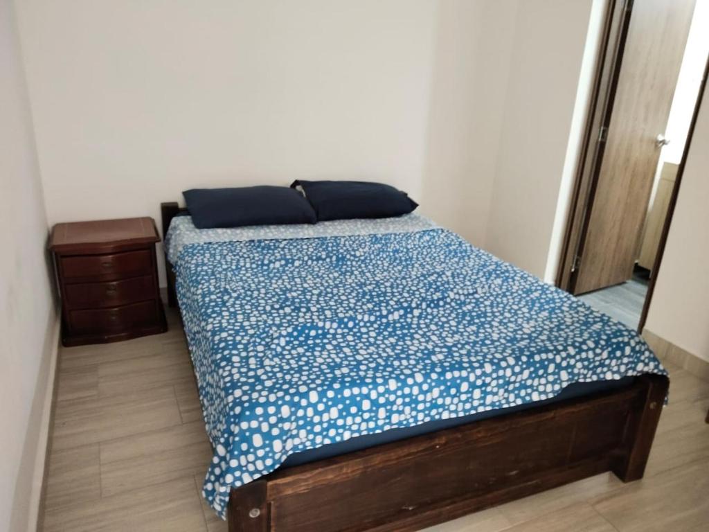 Postel nebo postele na pokoji v ubytování Apartamento en Ricaurte, Arrayanes de Peñaliza