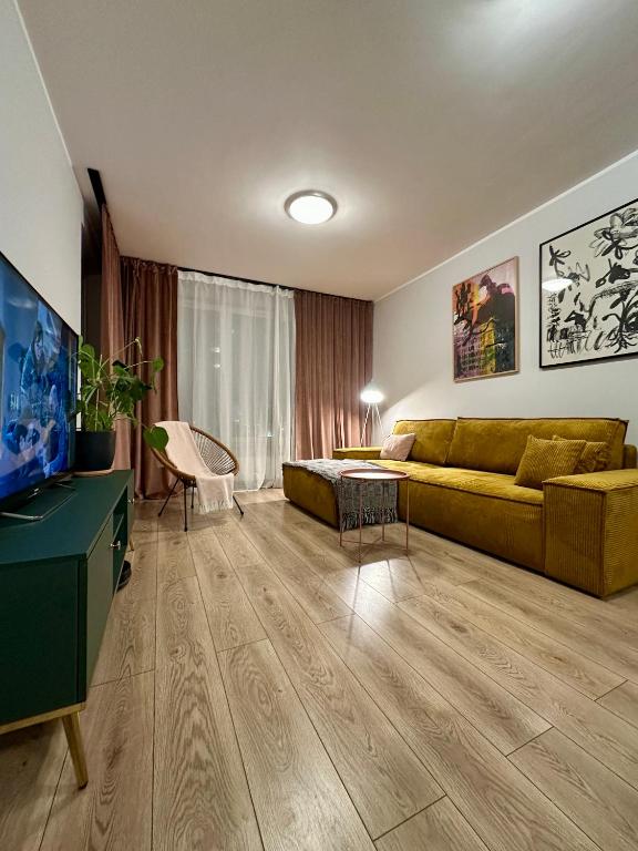 Televízia a/alebo spoločenská miestnosť v ubytovaní MOMOApart - Downtown Tram Depot