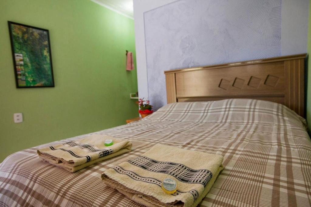 Postel nebo postele na pokoji v ubytování Pousada na trilha das artes