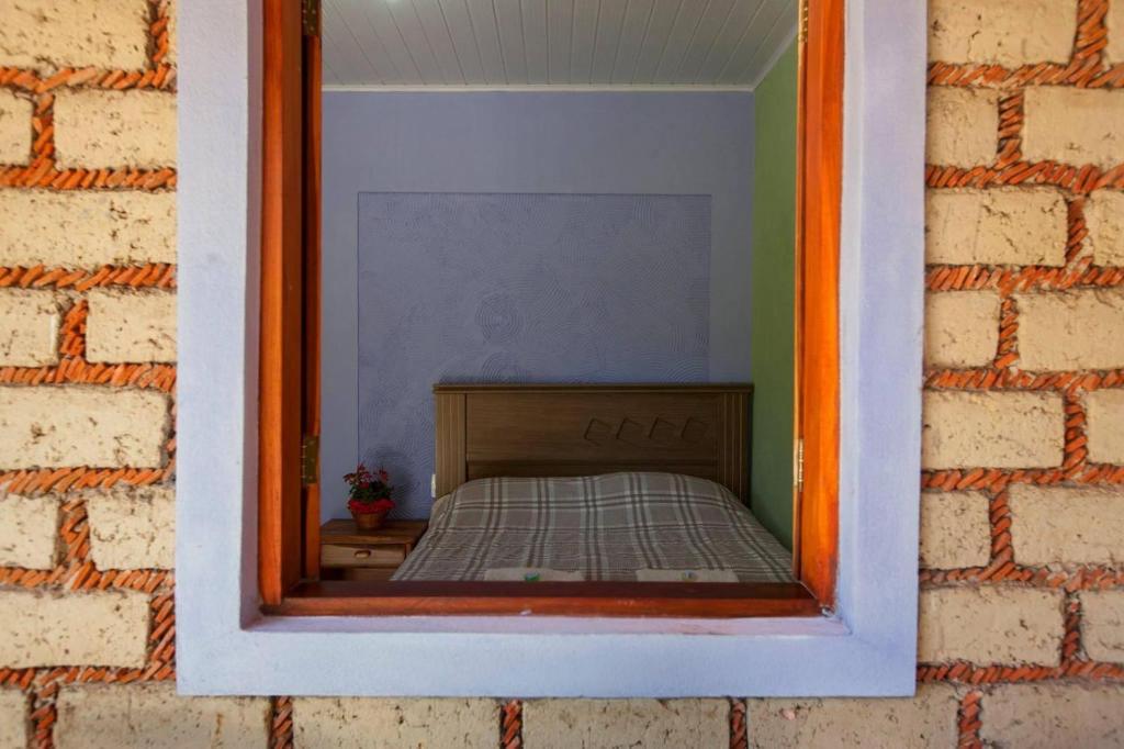 Postel nebo postele na pokoji v ubytování Pousada na trilha das artes