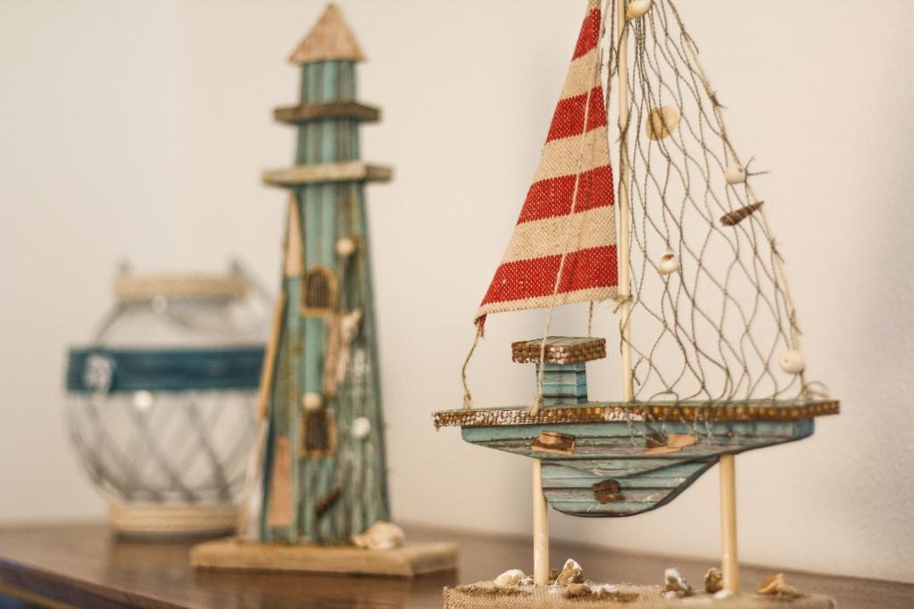 two wooden toy boats sitting on a table at Quinta das Andorinhas in Carvoeiro