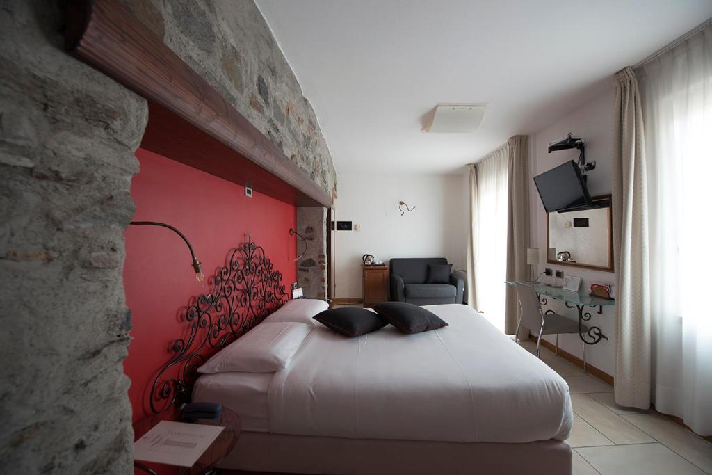 Posteľ alebo postele v izbe v ubytovaní Hotel Villa Colico