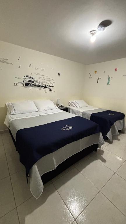 Postel nebo postele na pokoji v ubytování Hotel Casa Luna