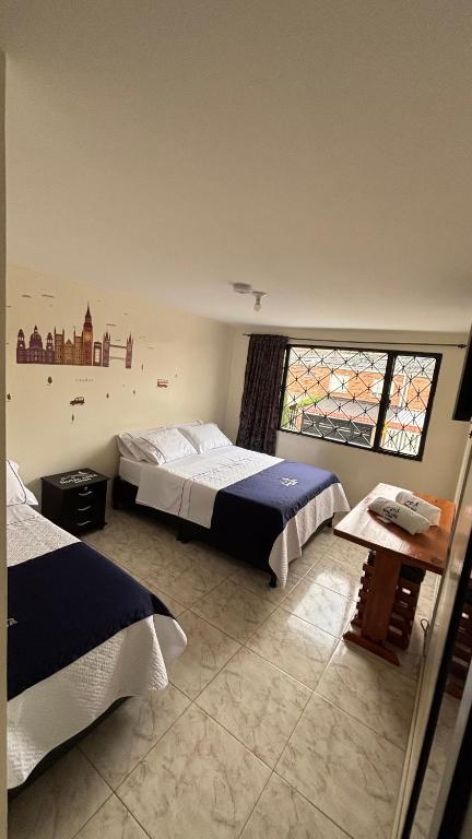Postel nebo postele na pokoji v ubytování Hotel Casa Luna