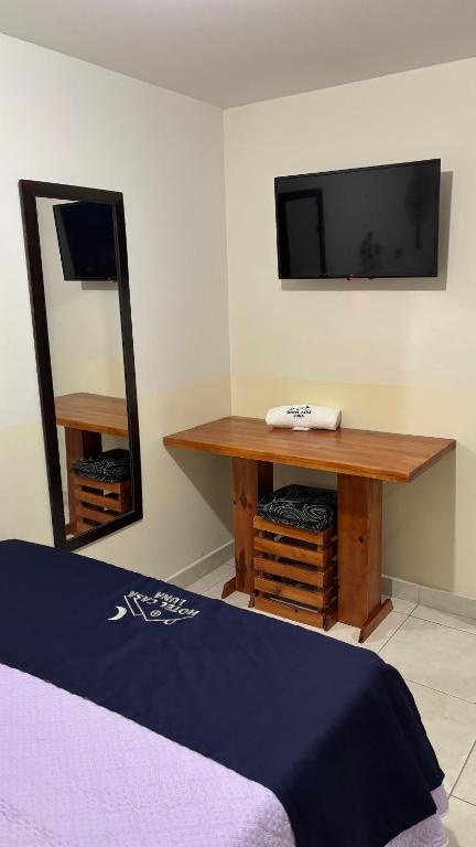 Postel nebo postele na pokoji v ubytování Hotel Casa Luna
