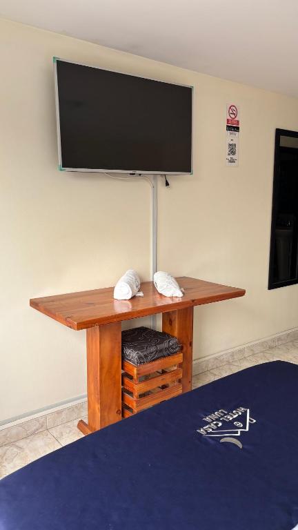 TV a/nebo společenská místnost v ubytování Hotel Casa Luna