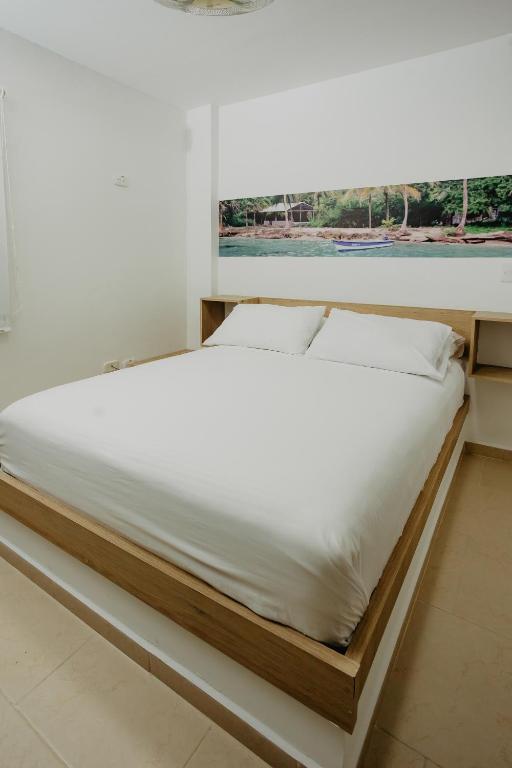 Postel nebo postele na pokoji v ubytování Hotel Plataneras Plaza