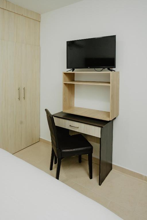 TV a/nebo společenská místnost v ubytování Hotel Plataneras Plaza