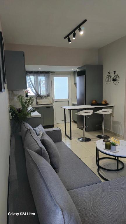 a living room with a couch and a table at Kos Cozy Apartment 2 in Kos Town