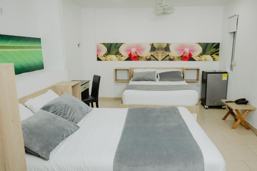 Postel nebo postele na pokoji v ubytování Hotel Plataneras Plaza