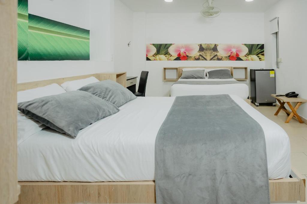 Postel nebo postele na pokoji v ubytování Hotel Plataneras Plaza