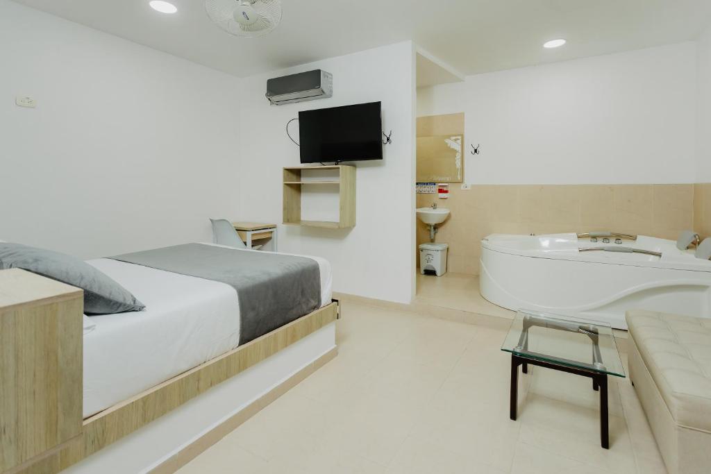 Postel nebo postele na pokoji v ubytování Hotel Plataneras Plaza