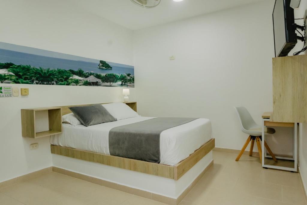 Postel nebo postele na pokoji v ubytování Hotel Plataneras Plaza
