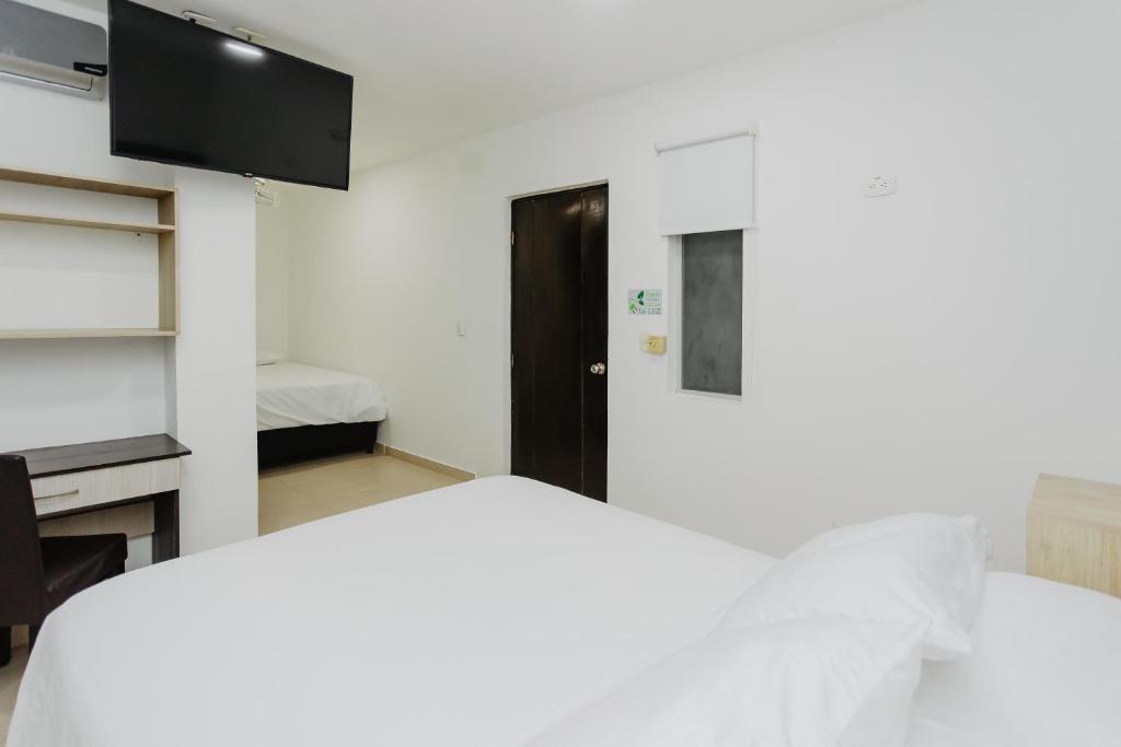 Postel nebo postele na pokoji v ubytování Hotel Plataneras Plaza