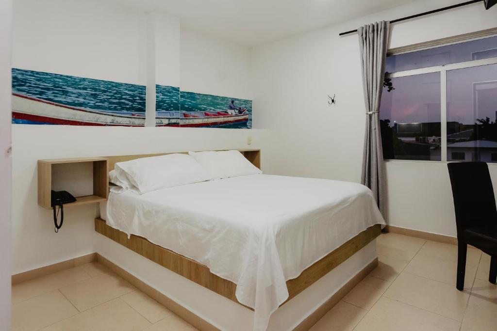 Postel nebo postele na pokoji v ubytování Hotel Plataneras Plaza