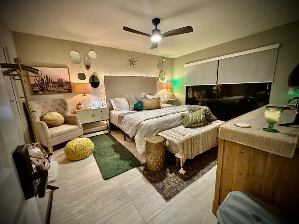 a living room with a bed and a couch at Spacious 1 BR villa on golf course with epic views! in Palm Desert