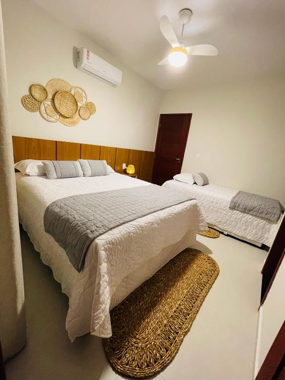 Postel nebo postele na pokoji v ubytování Chalé Paraíso Santo Amaro
