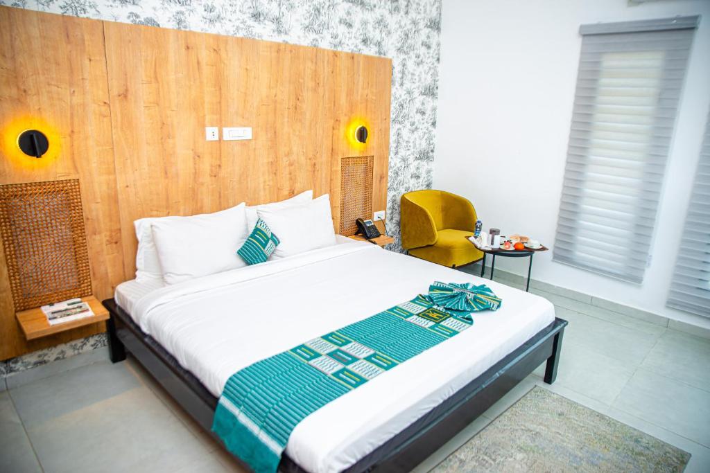 Postel nebo postele na pokoji v ubytování Hotel Yatchenin Abidjan