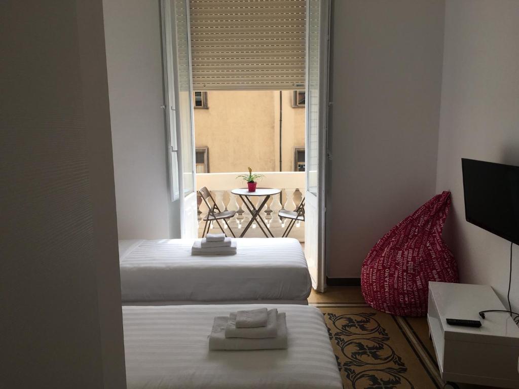 Posteľ alebo postele v izbe v ubytovaní Cagliari d'Amare Via Roma