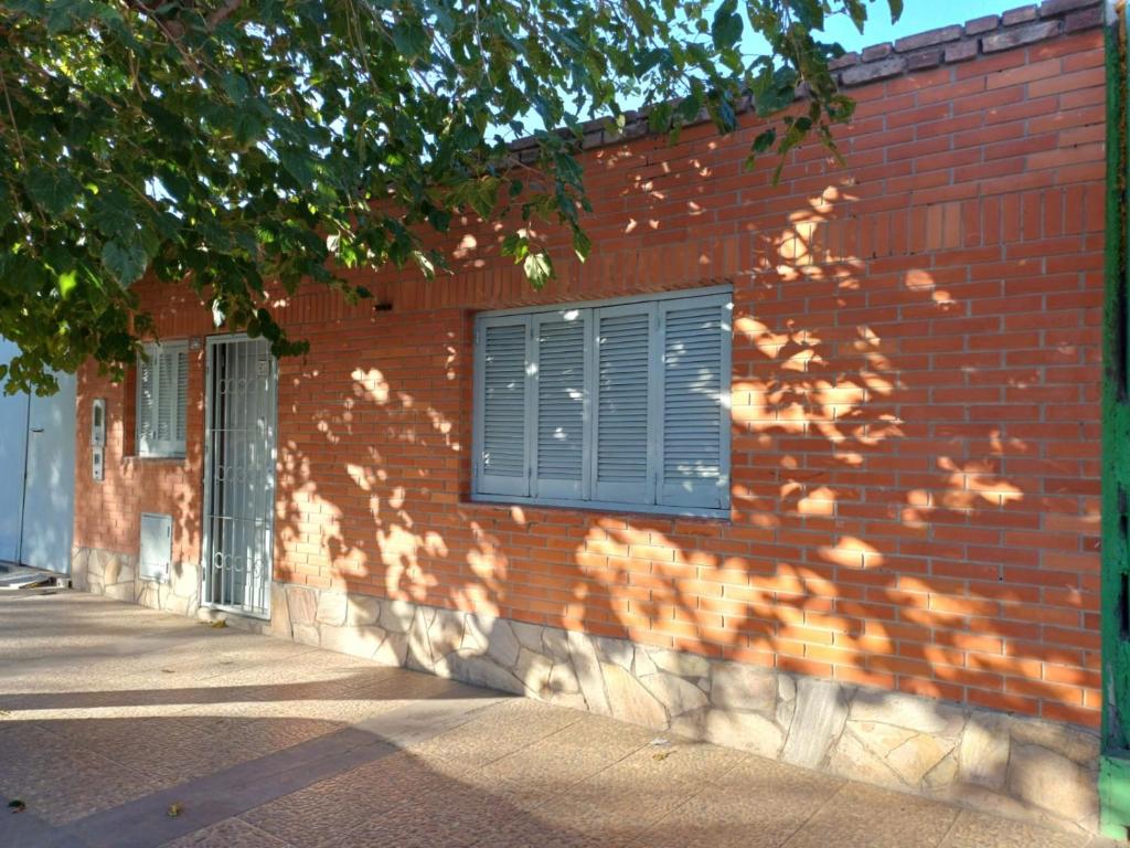 a brick wall with a window on a building at TRINIDAD in San Juan
