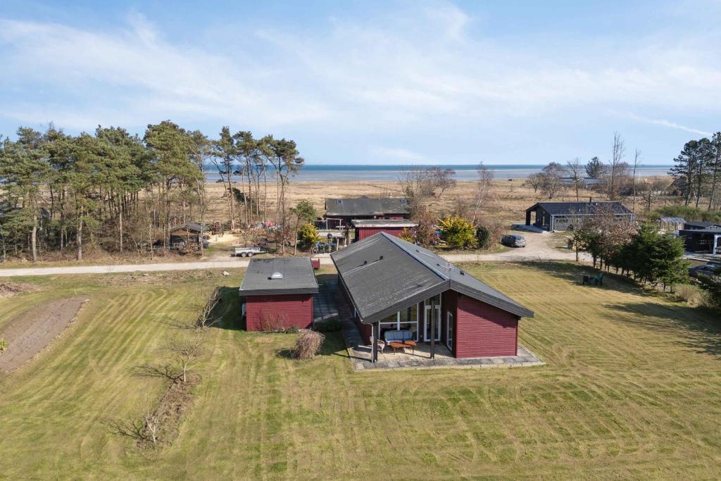 an aerial view of a small house in a field at Lovely Bright House Near The Beach In Nature in Ørsted