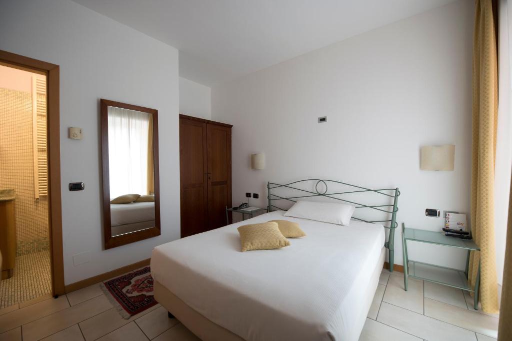 Posteľ alebo postele v izbe v ubytovaní Hotel Villa Colico