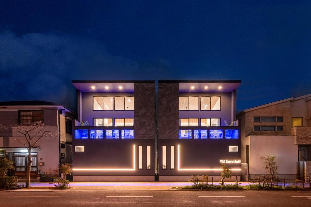 a building with lights on it at night at Universal front villa Sanrriott in Osaka