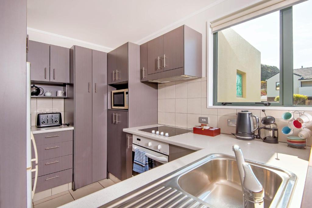 Kuchyň nebo kuchyňský kout v ubytování Beachpoint Apartments