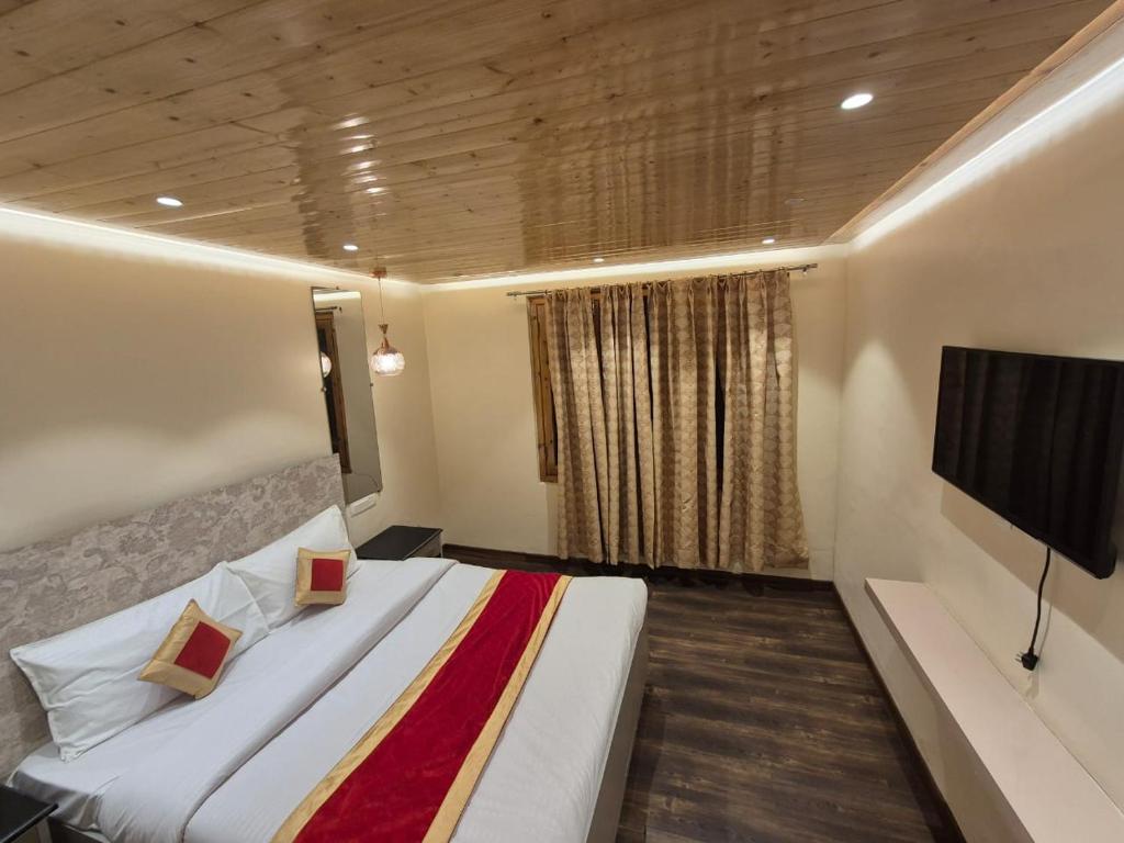 Postel nebo postele na pokoji v ubytování New Maya Home Stay