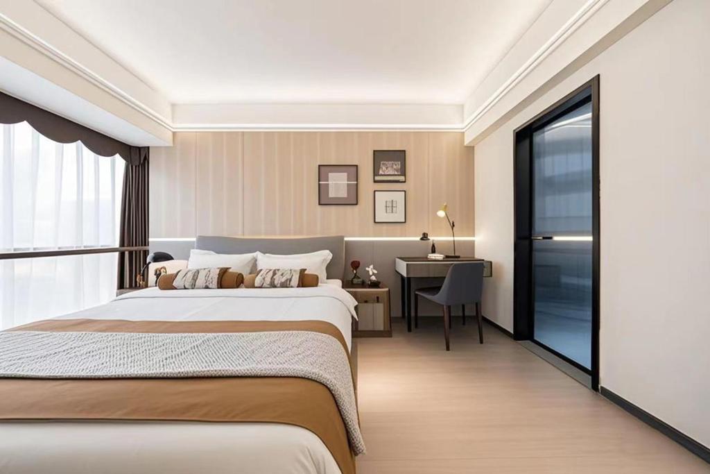 Postel nebo postele na pokoji v ubytování 颐程City View Hotel-广州太古汇珠江新城体育中心石牌桥地铁站店-广交会专享