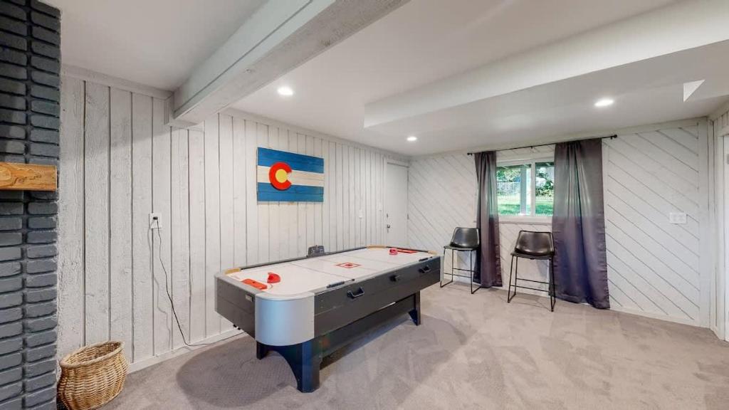 a room with a pool table in a room at Cozy Four Bedroom Family Retreat with Yard and Air Hockey in Centennial