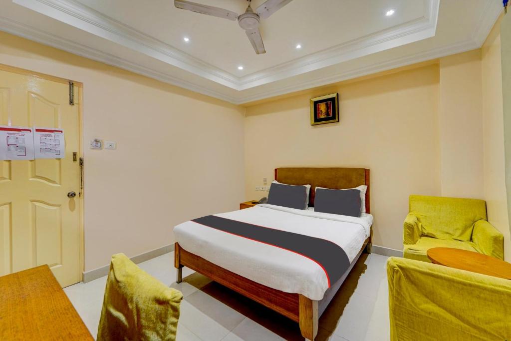 Postel nebo postele na pokoji v ubytování Super Hotel O G Silver Ashok Nagar