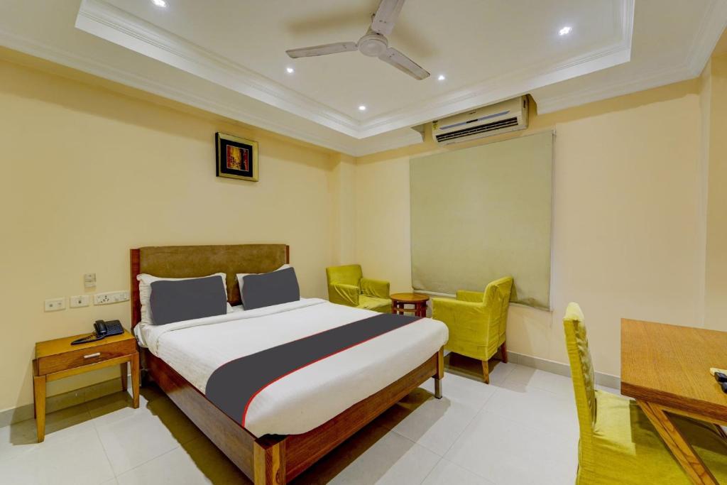 Postel nebo postele na pokoji v ubytování Super Hotel O G Silver Ashok Nagar
