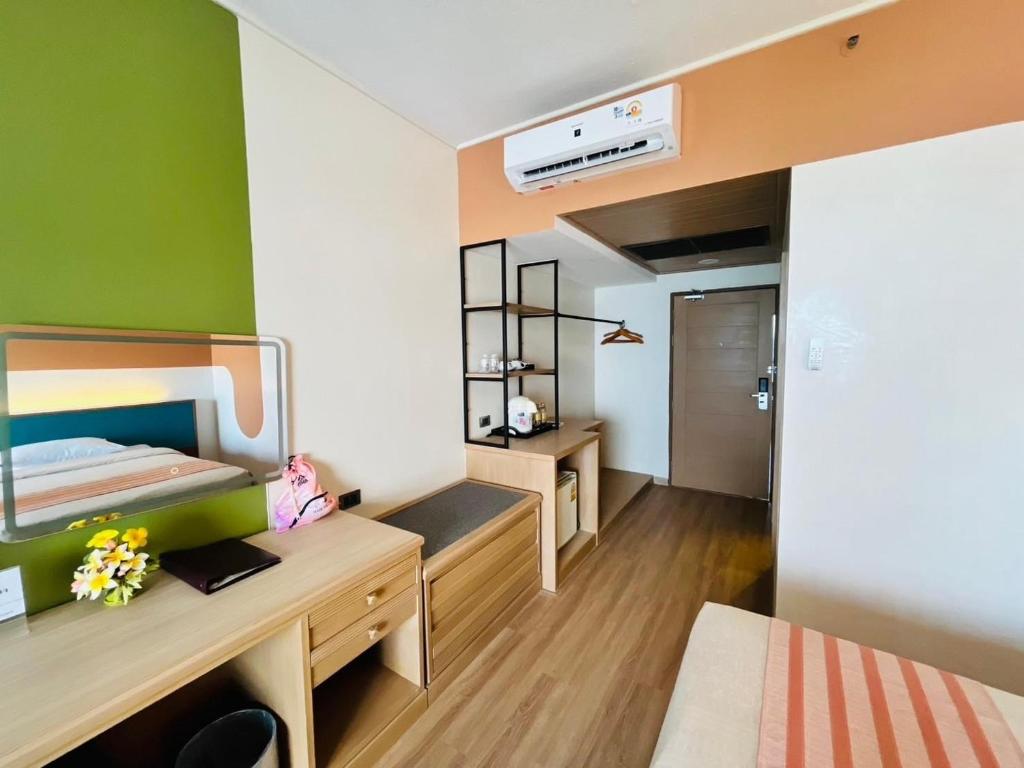 Postel nebo postele na pokoji v ubytování Asia Cha-am Hotel