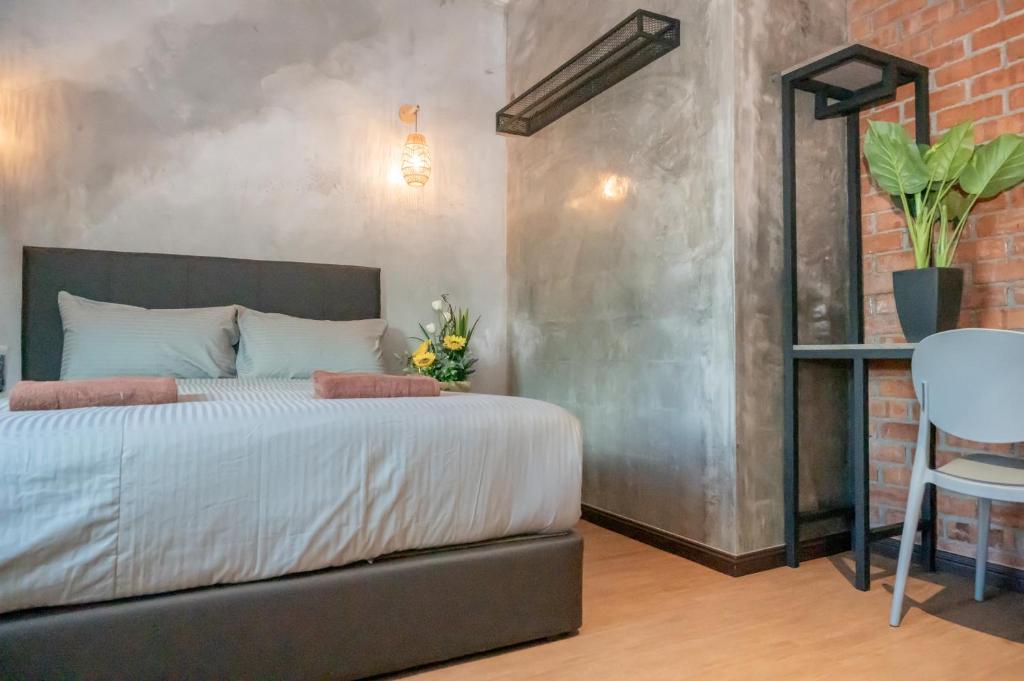 Postel nebo postele na pokoji v ubytování Bricks Guesthouse