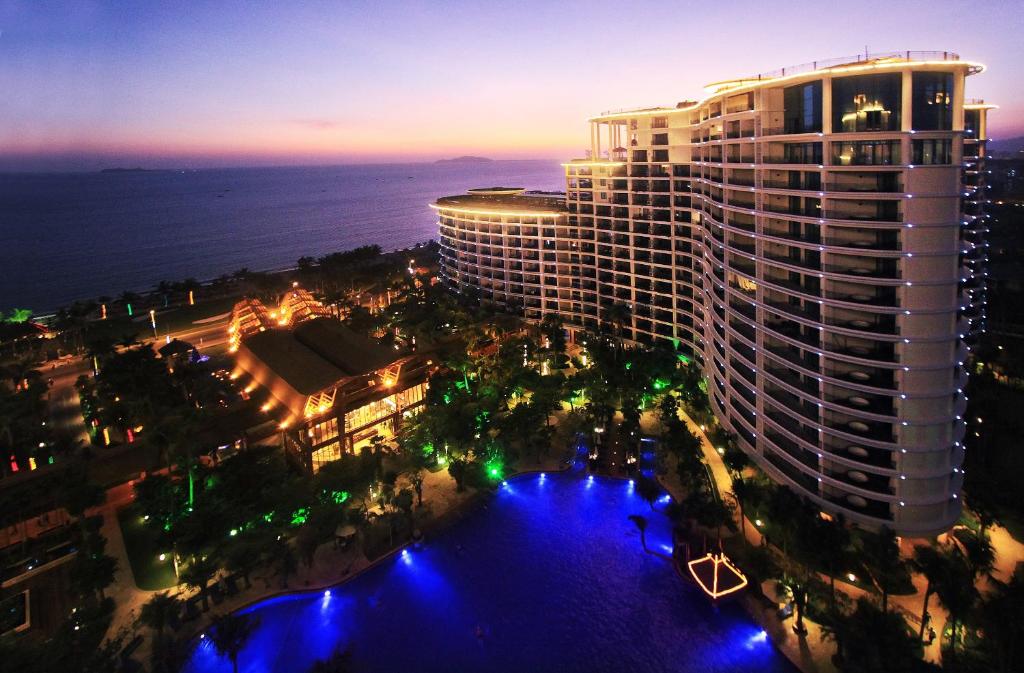 an aerial view of a large building at night at Ocean Sonic Resort Sanya in Sanya