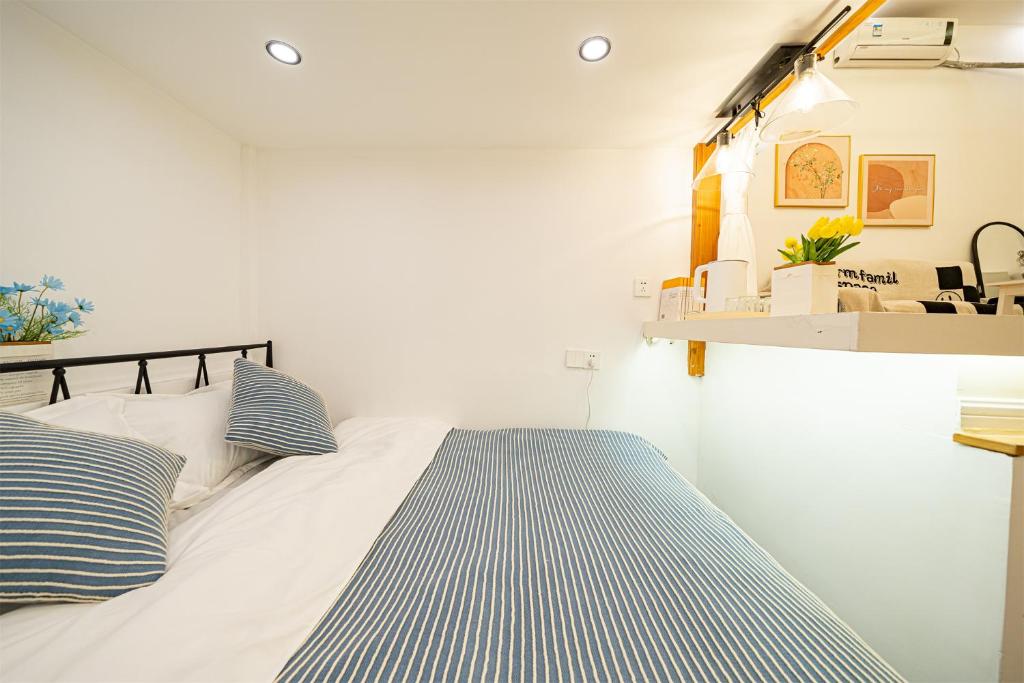 Postel nebo postele na pokoji v ubytování 柃居 B&B - IAPM Branch