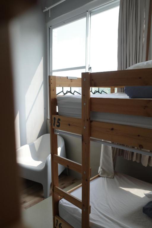 Postel nebo postele na pokoji v ubytování Ji Zi Inn