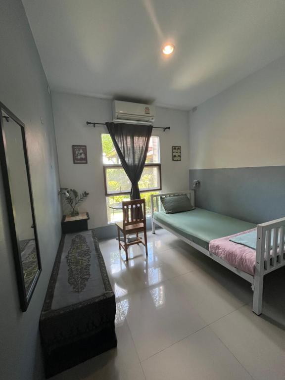 Postel nebo postele na pokoji v ubytování Ananas Samui Hostel
