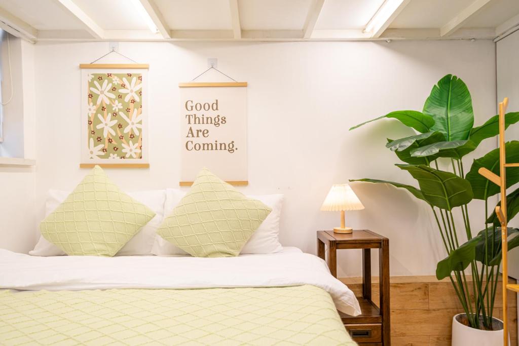 Postel nebo postele na pokoji v ubytování 柃居 B&B - IAPM Branch