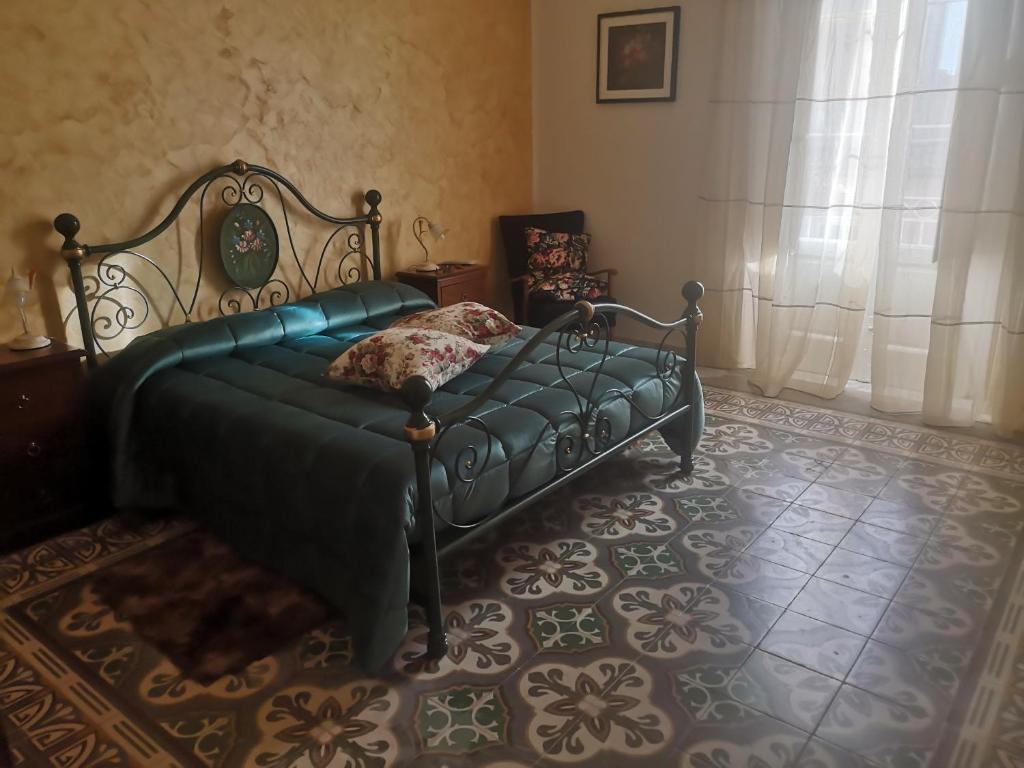 Postel nebo postele na pokoji v ubytování maison giovanna