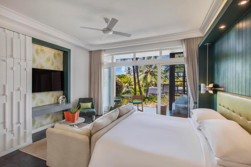 Postel nebo postele na pokoji v ubytování Long Beach Mauritius