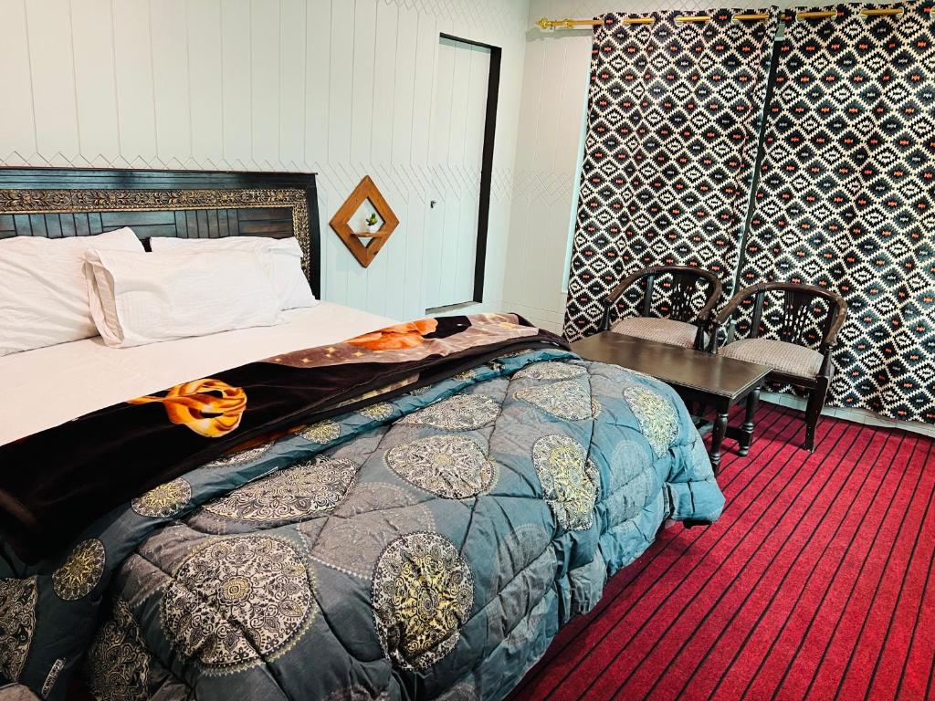 Postel nebo postele na pokoji v ubytování Skardu Lodge