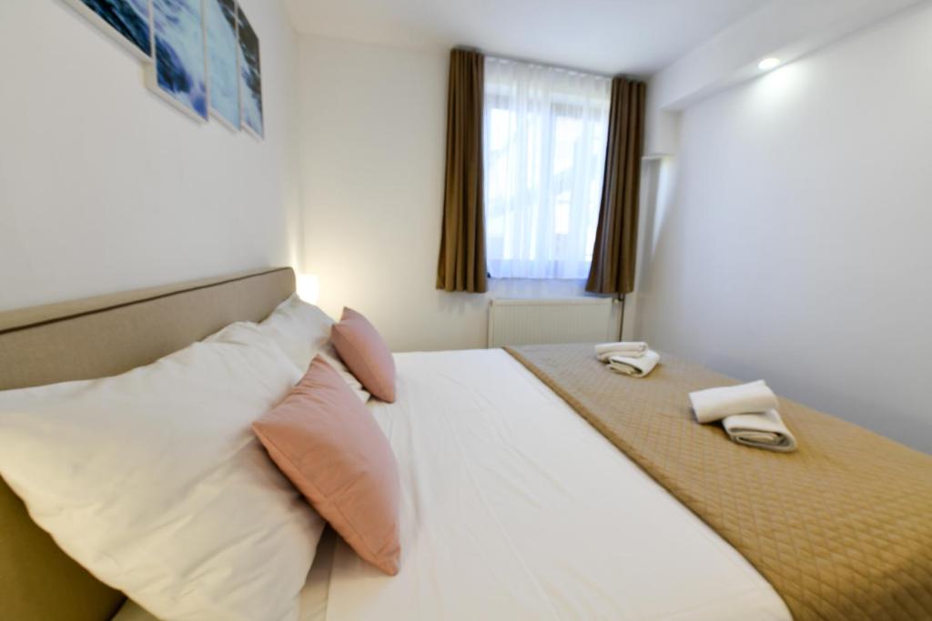Posteľ alebo postele v izbe v ubytovaní Apartment Mlađen