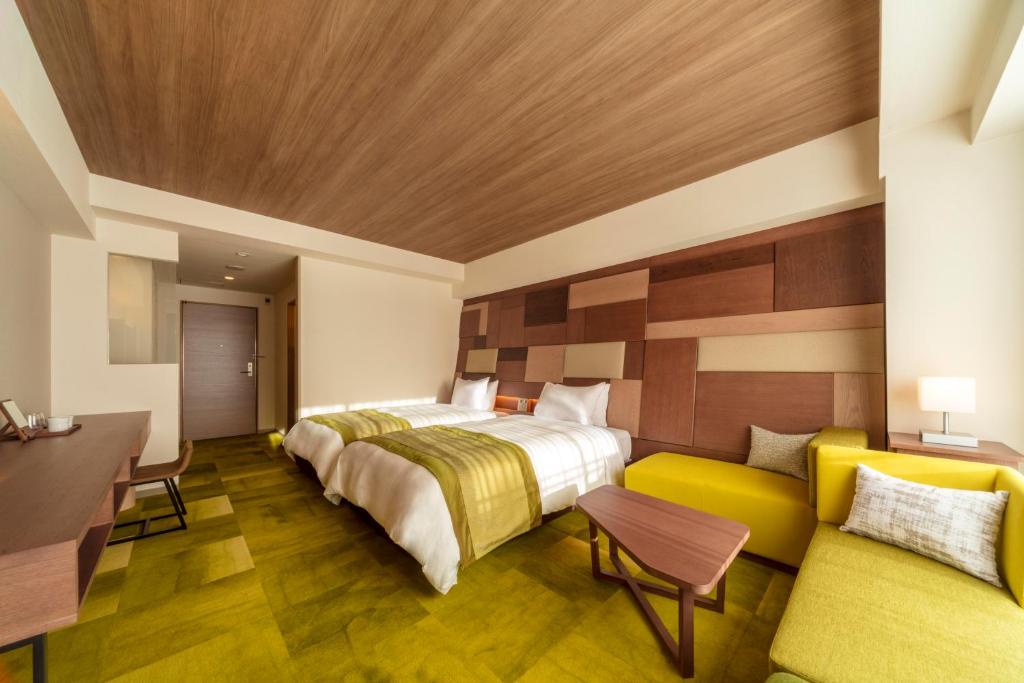 Postel nebo postele na pokoji v ubytování Izumigo AMBIENT Tateshina Hotel