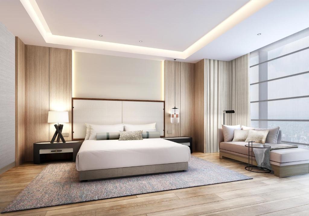 Postel nebo postele na pokoji v ubytování JW Marriott Hotel Nairobi