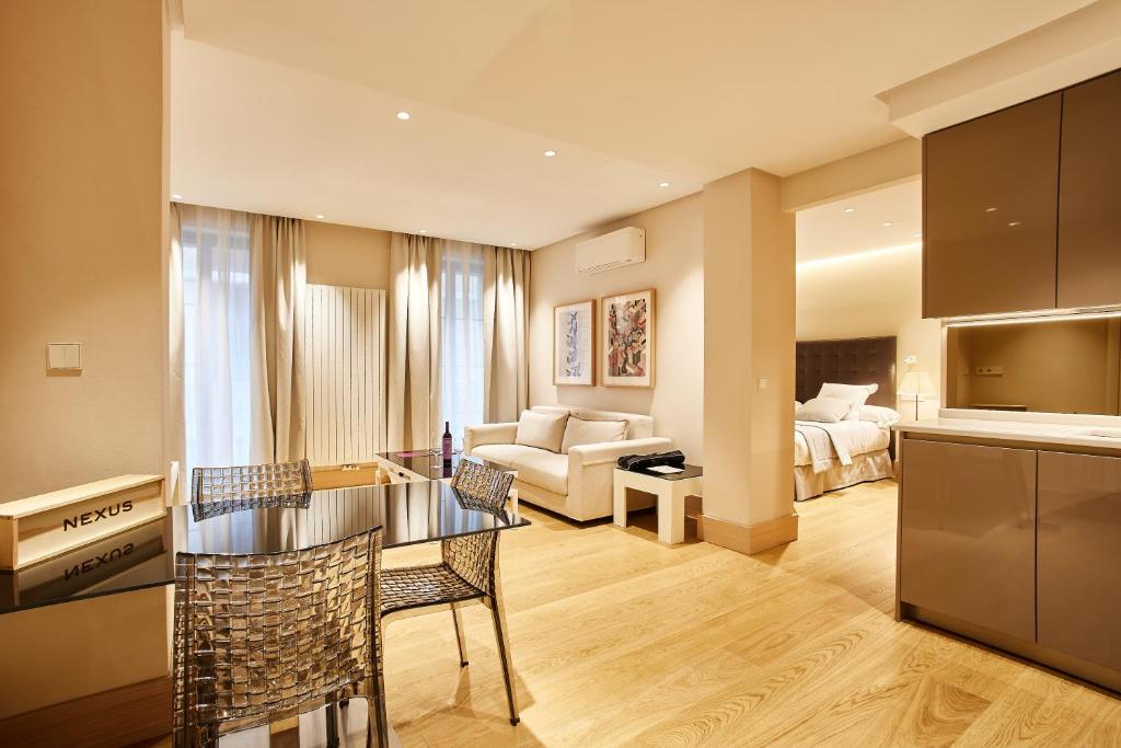 Ένα ή περισσότερα κρεβάτια σε δωμάτιο στο Nexus Santa María Luxury Apartamentos