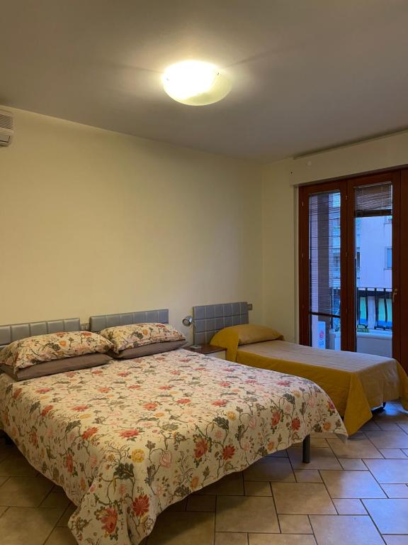 Postel nebo postele na pokoji v ubytování Studio Sole e Residenza Luna Assisi